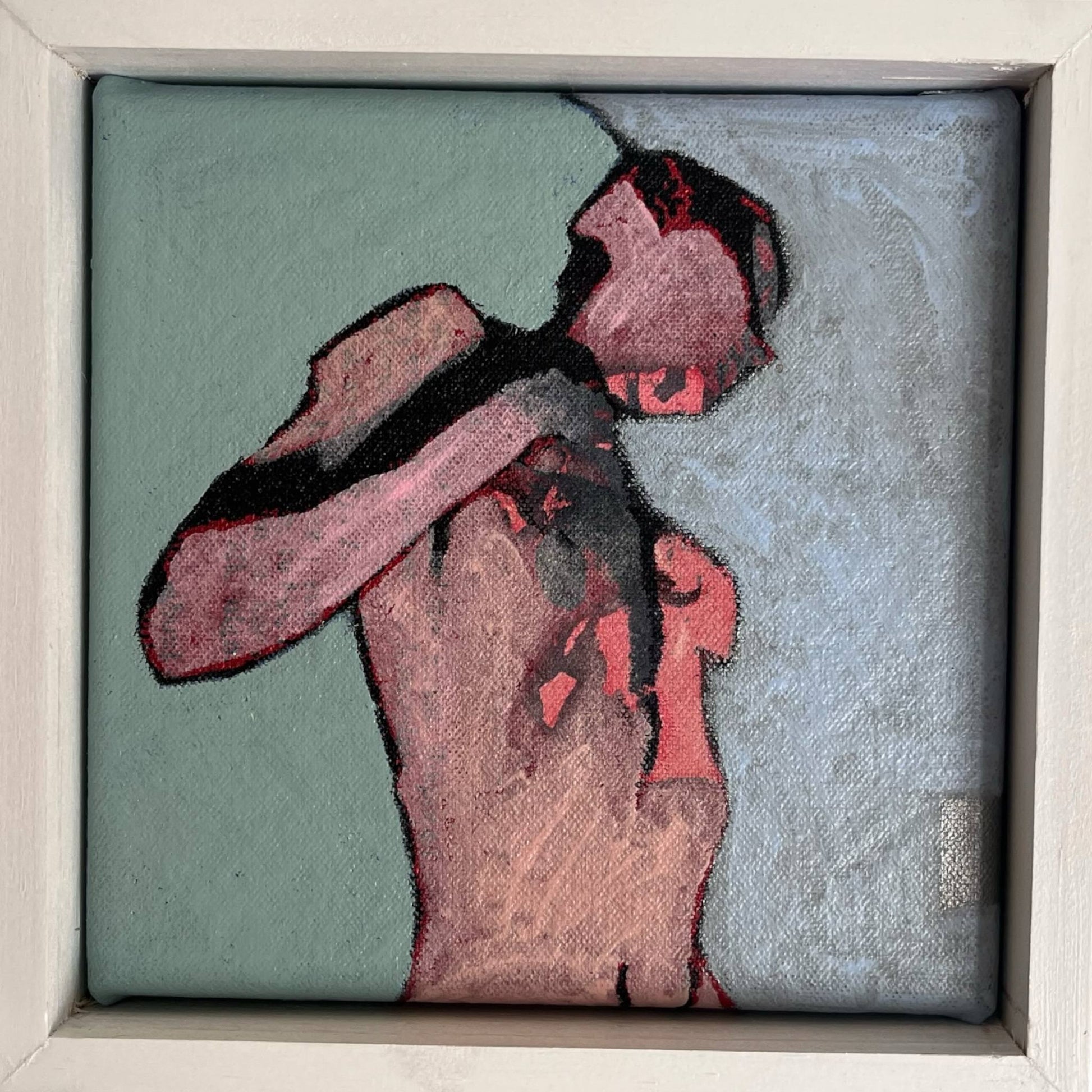 An original mixed media painting on canvas of a figure on a turquoise background in a white wood frame by Annette Sullivan Art